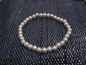 Wonderful simple small silver tone plastic beads elasticated  - Picture 1 of 3
