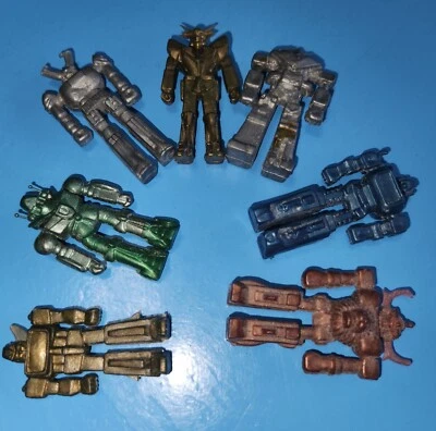 7 - LOTE DE MINI FIGURAS DE PVC VINTAGE DE LOS 80 ROBOT GRIEGO CARABOLA TAZA DE LA SUERTE 1,75-2" JUGUETES Foto 1 de 4