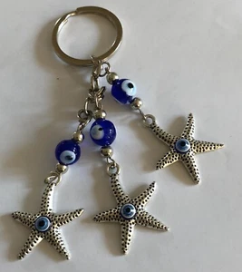 Böser Blick Schutz Glücksbringer Schlüsselanhänger Glasperlen Seestern silberfarben A76 - Bild 1 von 5