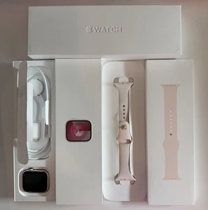APPLE WATCH - SERIES 9 45MM PINK ALUMINUM - S/M LIGHT PINK SPORT BAND - CELLULAR - Picture 1 of 14
