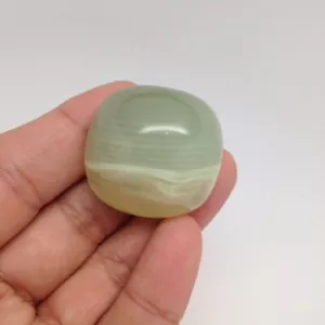 133,5 cts Honigfarbencalcit perfekt polierter Cabochon aus Pakistan, ca16 - Bild 1 von 4