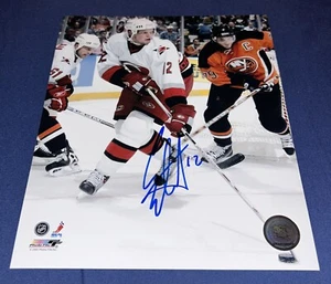 ERIC STAAL SIGNED 8X10 PHOTO CAROLINA HURRICANES HOCKEY NHL AUTOGRAPH AUTO - Picture 1 of 1