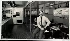 1983 Press Photo Manager Barry Cooper sits in the Festo Expotainer in Charlotte - Picture 1 of 2