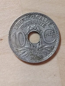 France 10 centimes coin, 1938. KM# 866a, copper-nickel. Monogram w/center hole. - Picture 1 of 4