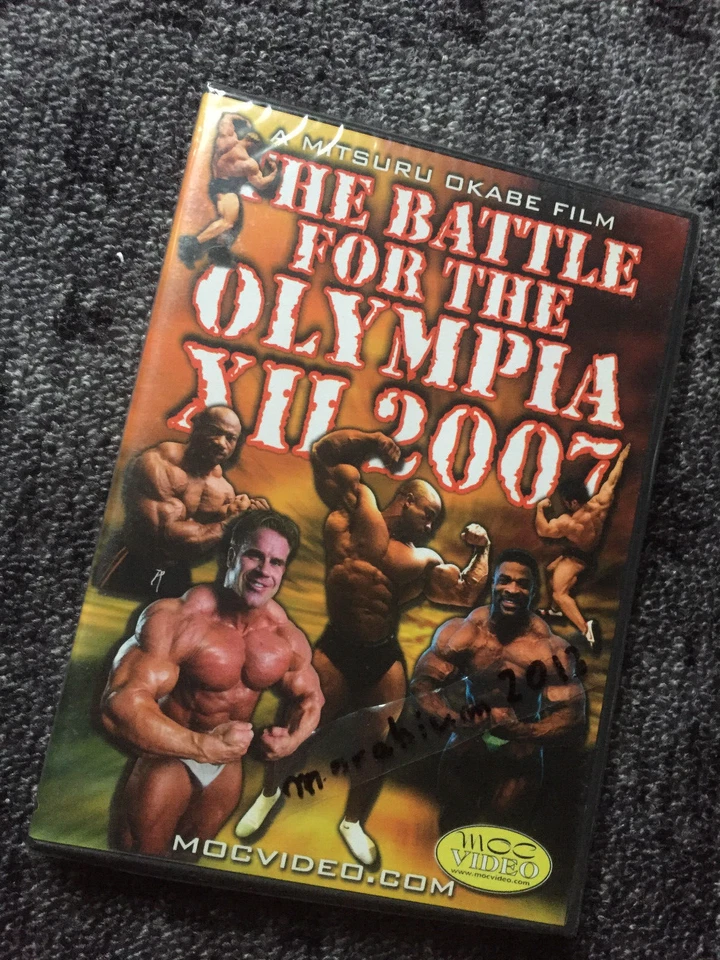 THE BATTLE FOR THE OLYMPIA XII 2007  - DVD - Region FREE - NEW - Bodybuilding - Image 1 of 1
