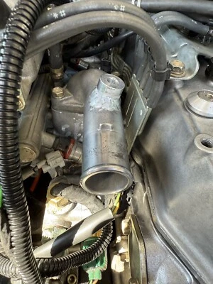 1984-1995 Toyota Pickup/4Runner 22RE/22RET/22RTE Long Thermostat Housing W/ Bung - Image 1 of 2