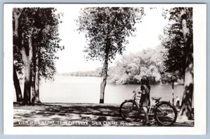 1940-50's RPPC GIRL BICYCLE SAUK CENTRE MINNESOTA LAKE VIEW from PARK POSTCARD - Picture 1 of 2