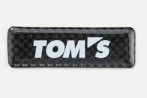 TOYOTA TOMS dry carbon emblem Logo Car sticker 08233-TSP09 New Black Silver - Picture 1 of 6