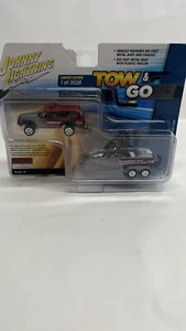 Johnny Lightning 1/64 Tow & go Jeep cherokee Xj red W/ boat & trailer NIB - Picture 1 of 6