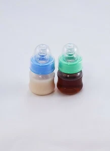 Dos biberones sellados de fórmula para bebé renacido de 2 oz y jugo de manzana ¡sin pezones agujeros! - Imagen 1 de 1