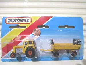 MATCHBOX 1983 TP108 Yellow TRACTOR + HAY TRAILER Two Pack Nu in Unopened Package - Picture 1 of 3