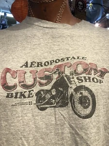 Camiseta gris LG para tienda de bicicletas personalizada Aeropostale para motocicleta - Imagen 1 de 8