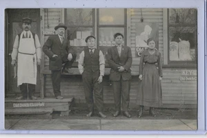 Real Photo Postcard RPPC - Butcher & Men & Woman in front of Grocery Store - Picture 1 of 2