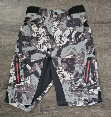 Pantalones Cortos de Ciclismo Zoic • Para Hombre Pequeño • Camuflaje Marrón Sin Acolchado • Ajustar Cintura • 26x11 Foto 1 de 4