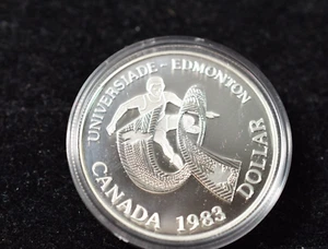 CANADÁ 1983 JUEGOS UNIVERSITARIOS EDMONTON DÓLAR DE PLATA EN SOPORTE ORIGINAL - Imagen 1 de 6