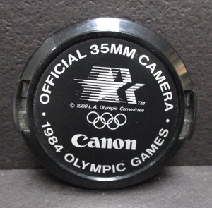 Canon Juegos Olímpicos 1984 52 mm cubierta de lente como nueva menos estado - Imagen 1 de 3