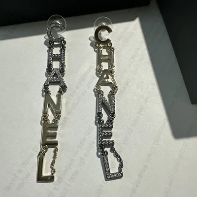 CHANEL EARRINGS DANGLE CHANEL LETTERS GOLD/SILVER TONE - Image 1 of 4