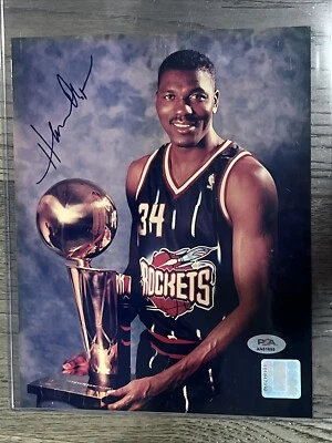 Hakeem Olajuwon 8*10 Autograph Photo NBA & PSA Certified.  Posing w/95' trophy - Image 1 of 4