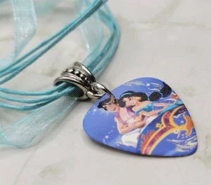 Aladdin and Jasmine Guitar Pick Necklace on Blue Ribbon Cord - Picture 1 of 2
