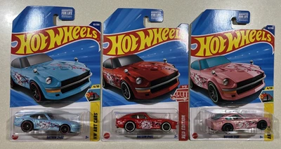 NEW 2025 Hot Wheels M CASE  DATSUN 240Z CHERRY BLOSSOMS  PINK ,RED & BLUE LOT 3 - Image 1 of 2