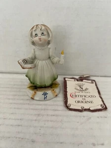 CAPODIMONTE Bambina che canta e tiene Bibbia e candela G Pezzato - Foto 1 di 8