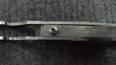 Antique Colt Lightning Medium Frame Magazine Gate Spring Screw - Image 1 of 3