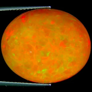 Ópalo etíope natural de 15,83 quilates certificado IGI marrón corte cabujón ovalado - Imagen 1 de 2