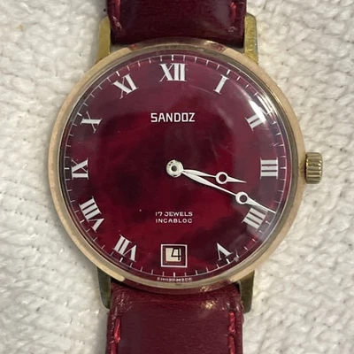 Reloj Sandoz Suizo 17 Joyas Incabloc Esfera Roja Números Romanos Placa de Oro.  Foto 1 de 4