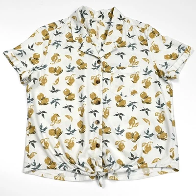 Top KUHL Elsie manga corta para mujer pequeño con botones corbata frontal patrón de limones dorados Foto 1 de 4