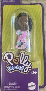Polly Pocket Shani Puppe.  Rosa Kleid, grüne Leggings und rosa Schuhe. - Bild 1 von 1