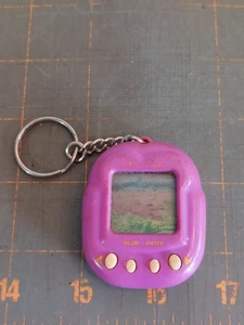 Vintage T-Rex Dino Virtual Cyber Pet Keychain - Picture 1 of 4