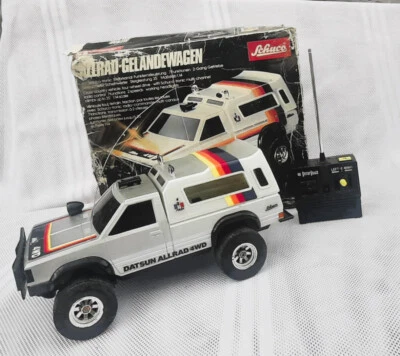 SCHUCO - ALLRAD GELÄNDEWAGEN ( Datsun )  1:14 mit Funkfernsteuerung - Bild 1 von 4