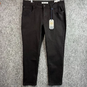Pantalones de mezclilla DKNY para hombre 36 x 30 ajustados elásticos negros nuevos con etiquetas - Imagen 1 de 13