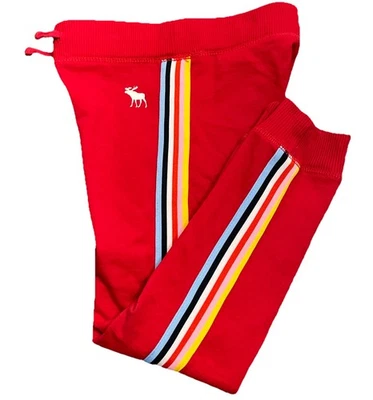 Pantalones de chándal para niños Abercrombie & Fitch talla 7/8. Rojo con rayas de color en las piernas. Foto 1 de 4