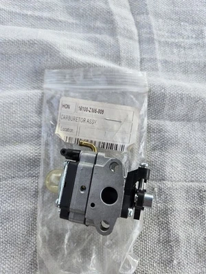 Карбюратор HONDA GX31 HHE31 HHT31 UMK431 WX10 16100-ZM5-809 подлинный/корзина 70 - Изображение 1 из 3