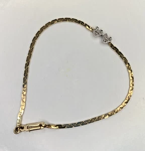 14K Gold Woman’s Bracelet with two White Gold Hearts and Diamonds - Picture 1 of 3