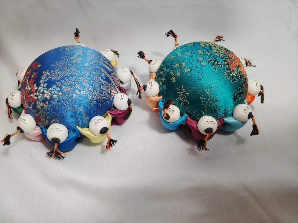 Vintage Silk Needle / Pin Cushion with Oriental Kids wrapped around. Set of 2 - Image 1 of 4