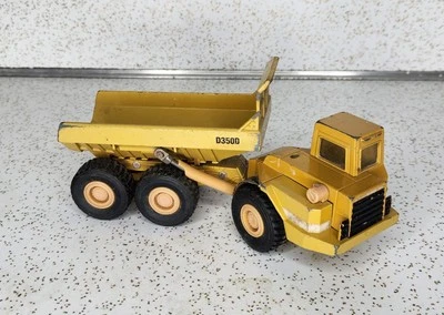 Camión de volteo articulado fundido a presión Ertl Mighty Movers 2431 1:50 Caterpillar D350D Foto 1 de 4