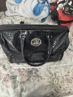 Bolso de viaje Kathy Van Zeeland de cuero negro Foto 1 de 4