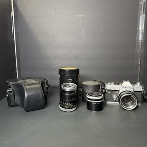 Cámara fotográfica Canon FTb QL 35 mm SLR plateada lente FD f/1,8 2 lentes y estuche - Imagen 1 de 24