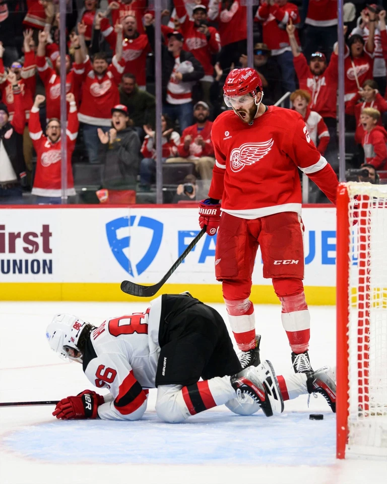 Michael Rasmussen Stands Over Jack Hughes Detroit Red Wings 8x10 NHL Photo - Image 1 of 1