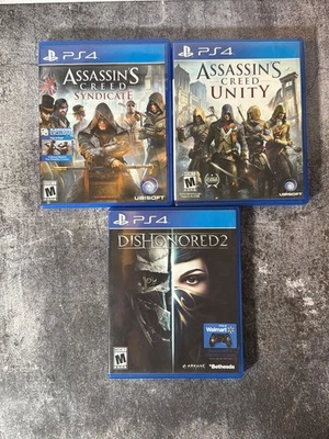 Lote de 3 juegos Ps4 Assassins Creed y Dishonored 2 Foto 1 de 4