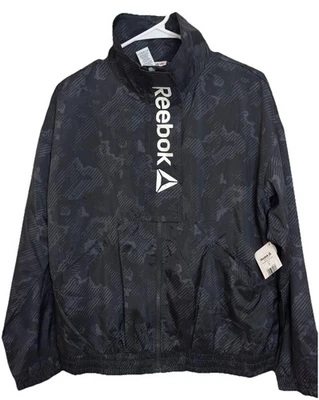 Nueva chaqueta cortavientos Reebok negra con cremallera completa para mujer talla pequeña - Nueva con etiquetas Foto 1 de 4