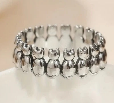 Anillo banda plata fila de gatos Foto 1 de 2