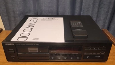 Reproductor de discos compactos múltiples Kenwood DP-M4010 con control remoto y 1 cargador Foto 1 de 4