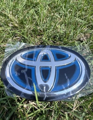 🔥90975-C2022 Toyota Camry Hybrid 2021-2024 parrilla delantera radar emblema compatible Foto 1 de 4