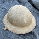 It is an early WWII US M1917A1 helmet, either new made in 1941 or a