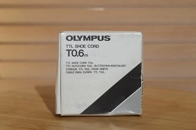 Boxed Olympus TTL Shoe Cord T0.6m. Comes with Instruction manual. - Image 1 of 4