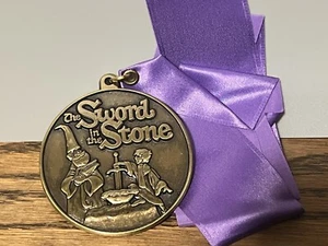 New In Bag RARE Sword In The Stone Bronze Medal Disneyland Purple Lanyard - Picture 1 of 3