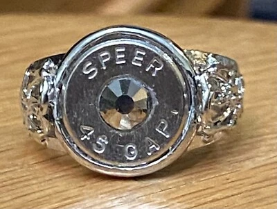 Anillo ajustable Speer calibre 45 carcasa bala níquel para mujer con cristal plateado Foto 1 de 4